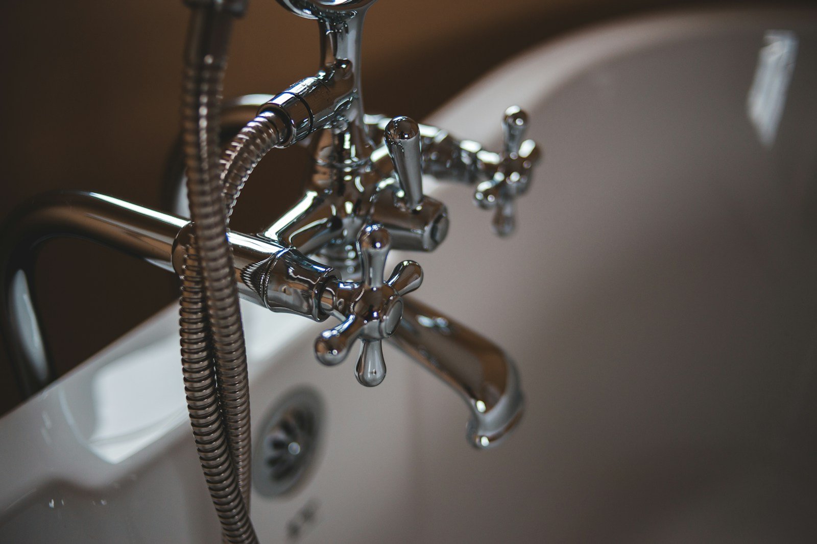 Plumber repairing a kitchen sink drain
